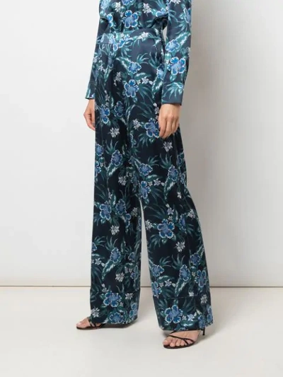 Shop Altuzarra Bani Floral Print Trousers In Blue