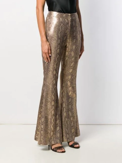 Shop In The Mood For Love Snakeskin Sprint Flared Trousers In Gold