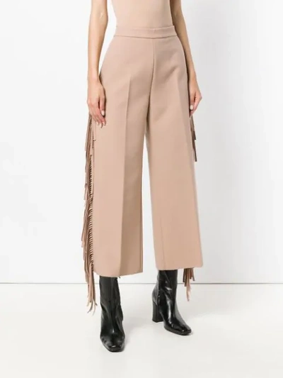 Shop Msgm Fringed Cropped Trousers In Neutrals