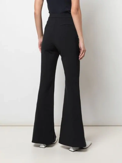 Shop Ellery High Waisted Flared Trousers In Black