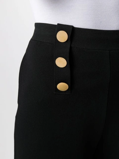 Shop Stella Mccartney Decorative Buttons Flared Trousers In Black