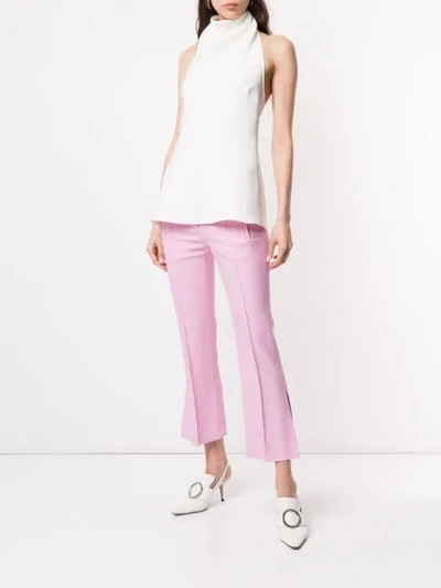 Shop Khaite Cropped Side Slits Trousers In Pink