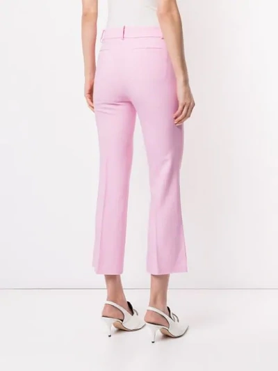 Shop Khaite Cropped Side Slits Trousers In Pink