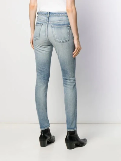 Shop Saint Laurent Stonewashed Skinny Jeans In Blue