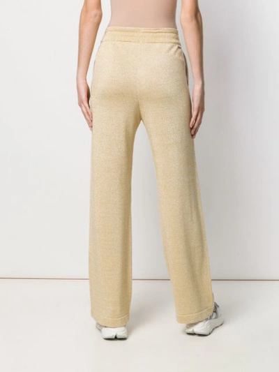 Shop Moncler Metallic Flared Trousers In Gold