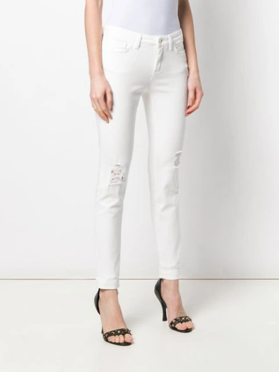 Shop Dolce & Gabbana Cropped Skinny Jeans In White