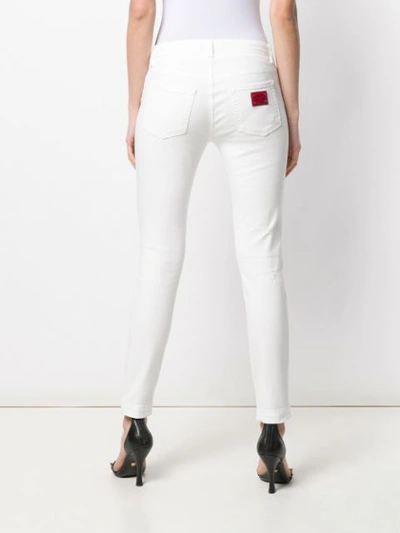 Shop Dolce & Gabbana Cropped Skinny Jeans In White