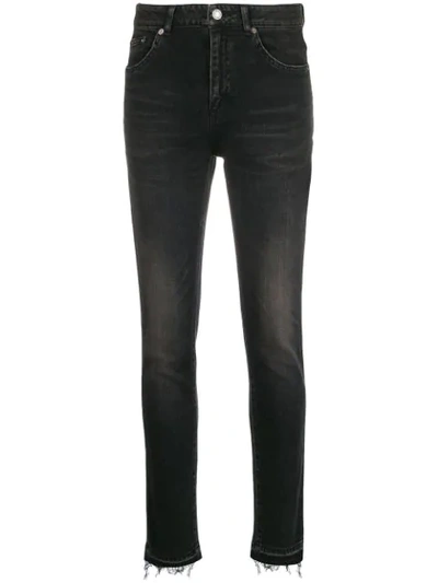 Shop Saint Laurent Stonewashed Skinny Jeans In Black