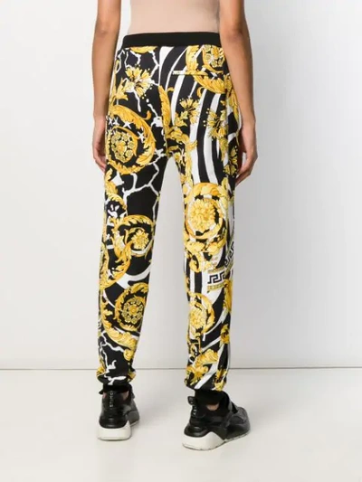 Shop Versace Savage Barocco Print Track Pants In A7900