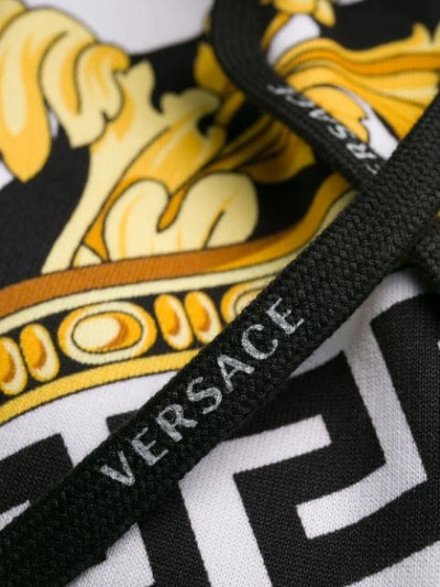 Shop Versace Savage Barocco Print Track Pants In A7900