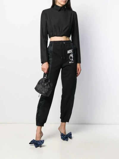 Shop Moschino Panelled Tapered Trousers In 6555 Black+nero