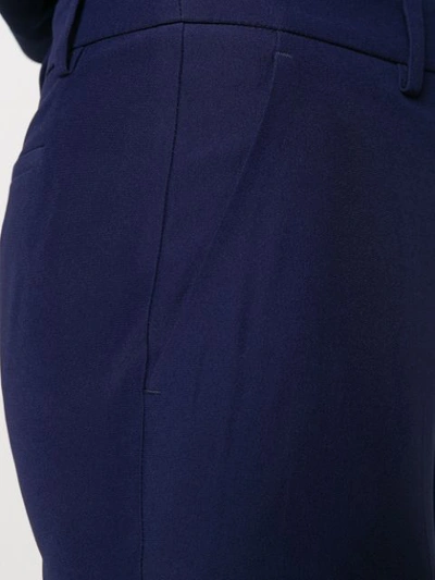 Alexander Mcqueen Longline Flared Virgin Wool-twill Trousers In Blue