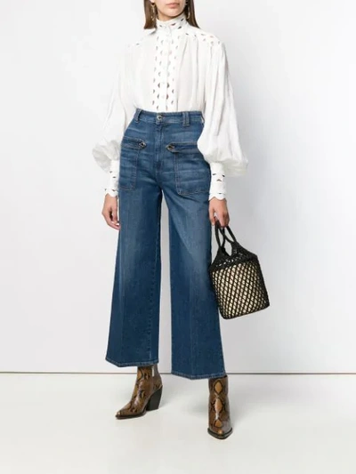 Shop Pinko Flared Cropped Jeans In Blue