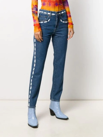 Shop Moschino Paint Stroke Jeans In Blue