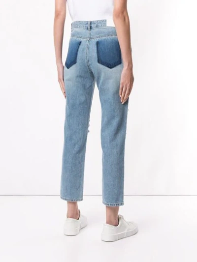 Shop Sjyp Ripped Mom Fit Jeans In Blue