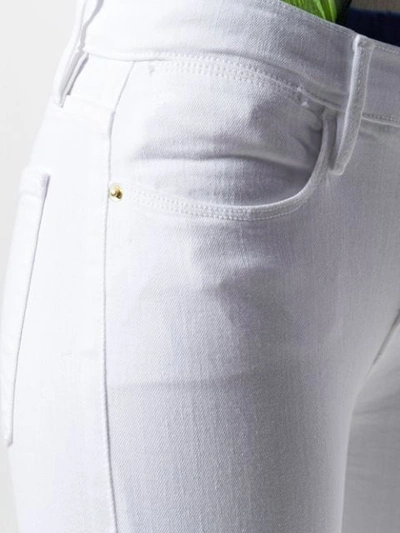 Shop Frame Le High Skinny Jeans In White