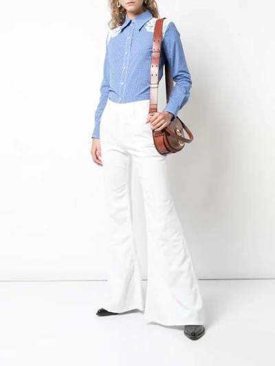 Shop Chloé High Waist Flared Jeans In White