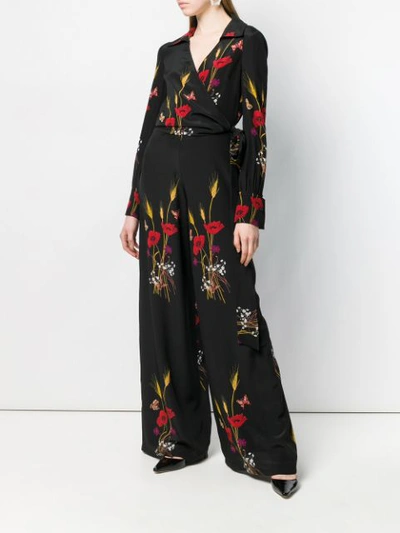 Shop Valentino Floral Print Jumpsuit In Black