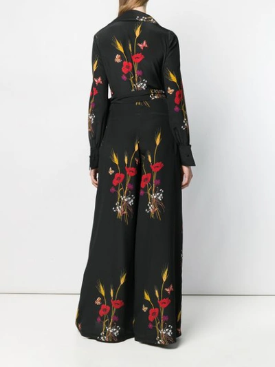 Shop Valentino Floral Print Jumpsuit In Black