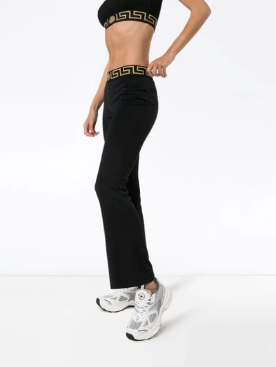 Shop Versace Logo-waist Track Trousers In Black