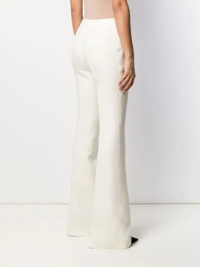 Shop Giambattista Valli Flared Trousers In White