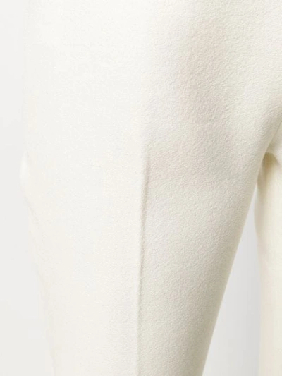 Shop Giambattista Valli Flared Trousers In White