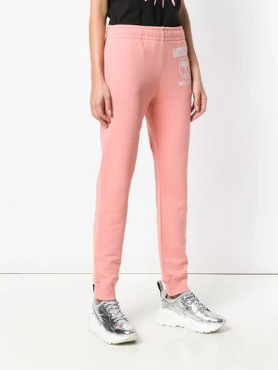 Shop Moschino Logo Track Trousers In Pink