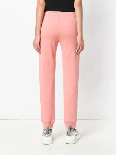 Shop Moschino Logo Track Trousers In Pink