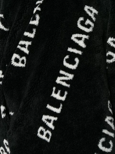 Shop Balenciaga All Over Logo Coat In Black