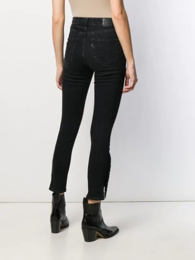 Shop Levi's Fringed Hem Skinny Jeans In Black