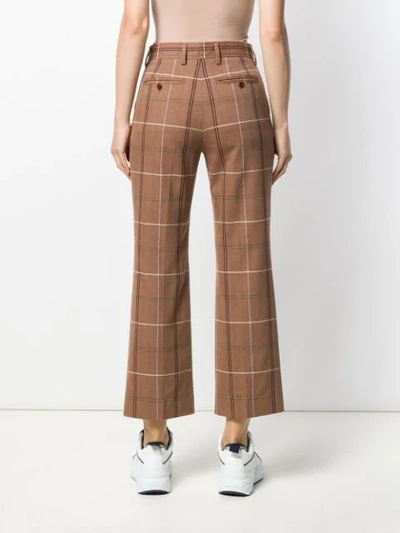 Shop Acne Studios Flared Crop Trousers In Brown