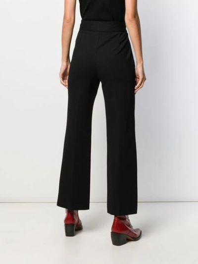Shop Sandro Flared Trousers In Black