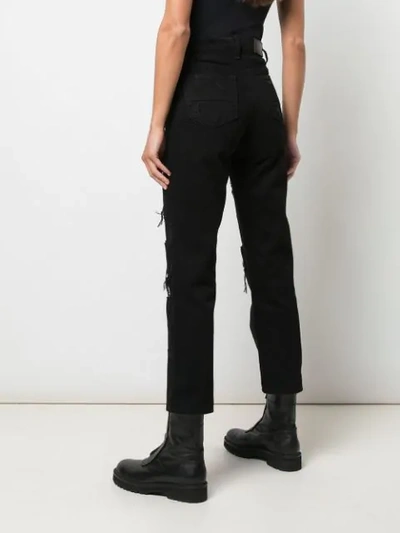 Shop Amiri Cropped Distressed Jeans In Black