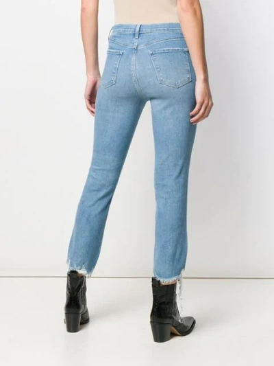 Shop J Brand Ripped Hem Jeans In Blue