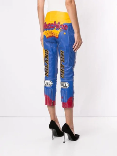 Shop Moschino Leather-effect Cropped Biker Trousers In Blue