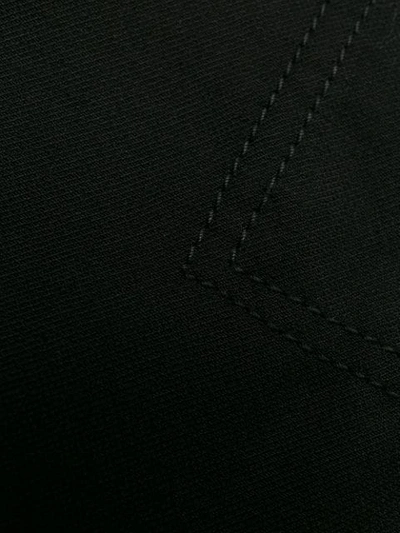 Shop Courrèges High Rise Logo Waistband Trousers In Black