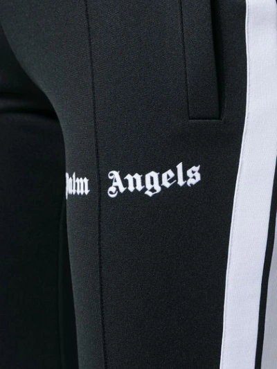 Shop Palm Angels Flared Side-stripe Joggers - Black