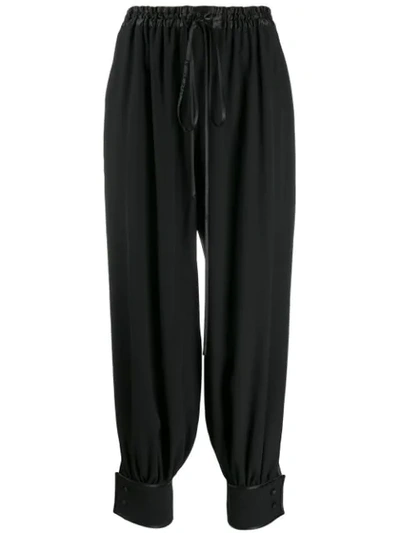 Shop Gucci Cuffed Drawstring Trousers In Black