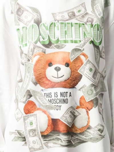 Shop Moschino Teddy Logo Dollar Hoodie In 3002 White