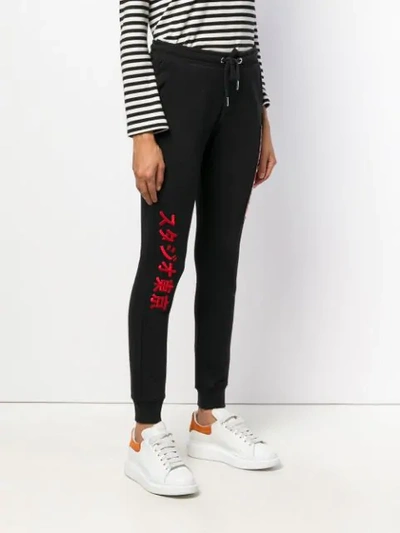Shop Zoe Karssen Embroidered Front Track Pants - Black