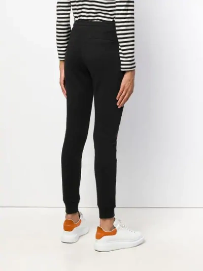 Shop Zoe Karssen Embroidered Front Track Pants - Black