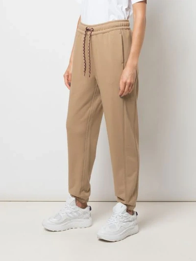 Shop Burberry Embroidered Logo Track Pants In Brown