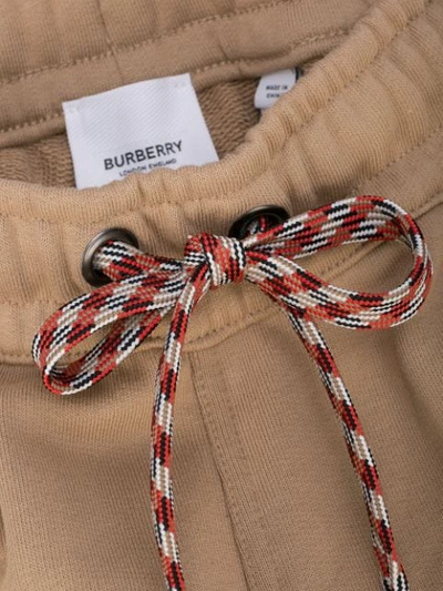 Shop Burberry Embroidered Logo Track Pants In Brown
