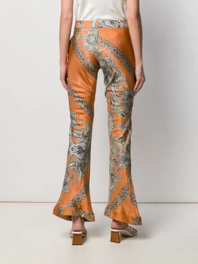 Shop Chloé Paisley Print Flared Trousers In Orange