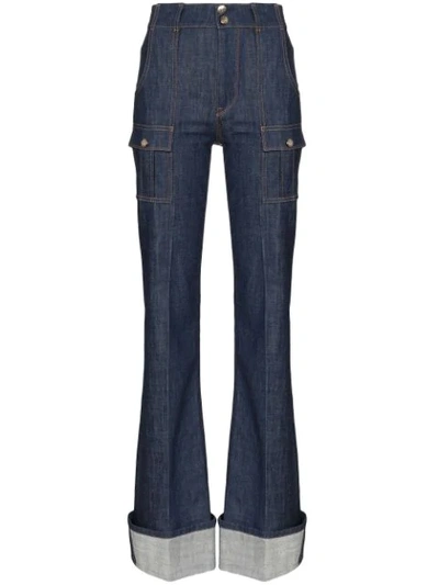 Shop Chloé Rolled-cuff Flared Jeans In Blue