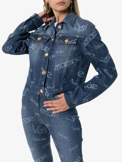 Shop Versace Logomania Print Denim Jacket In Blue