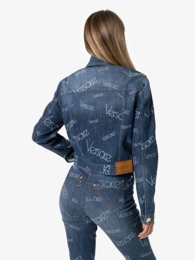 Shop Versace Logomania Print Denim Jacket In Blue