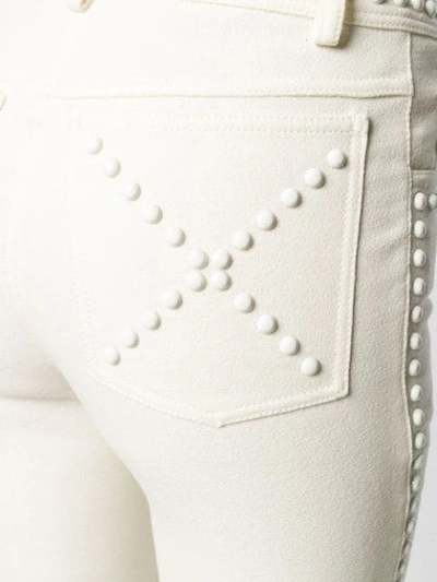 Shop Giambattista Valli Studded Flared Trousers In White