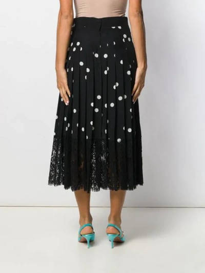 Shop Dolce & Gabbana Polka Dot Midi Skirt In Black