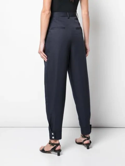 Shop Tibi Techy Twill Pleated Trousers In Blue
